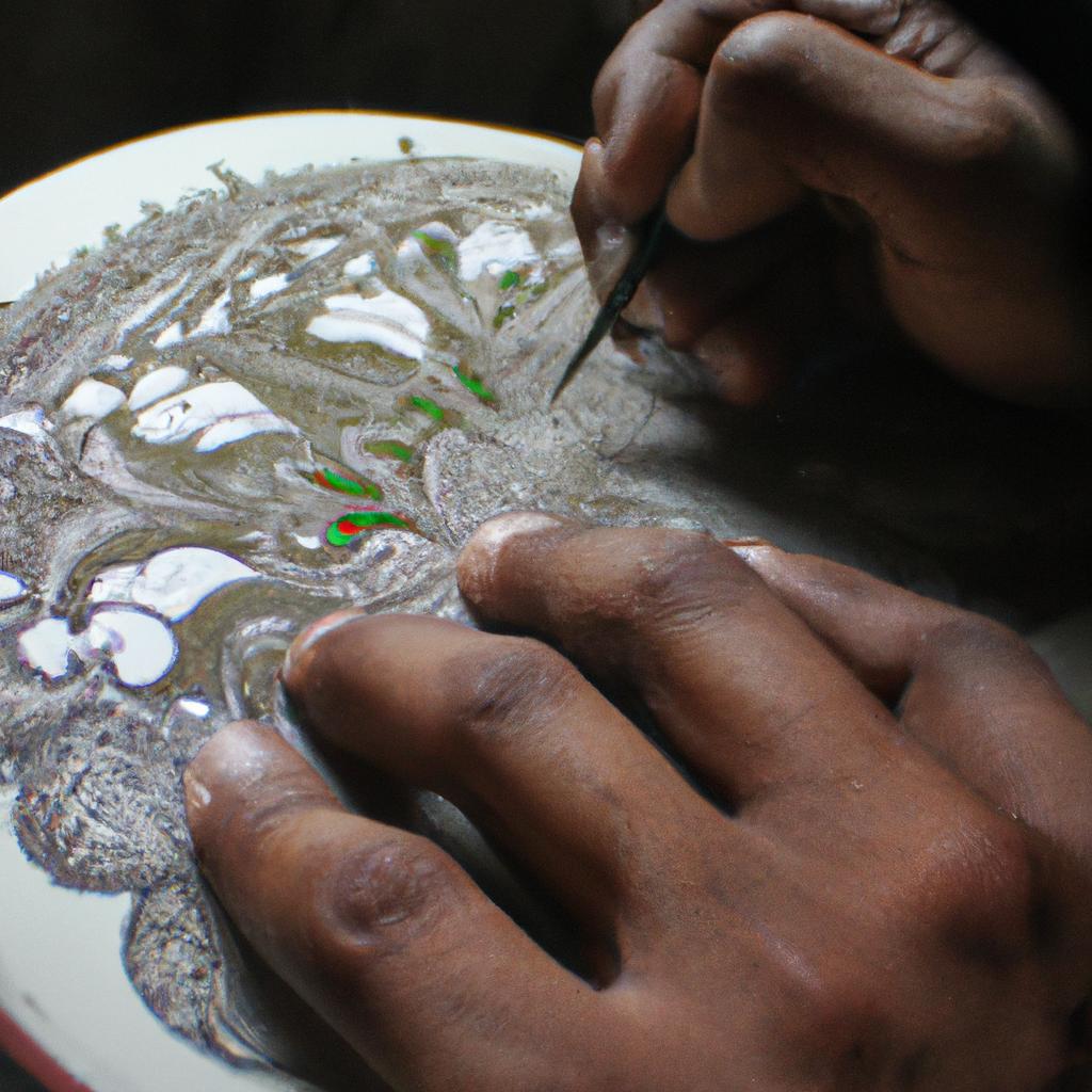 Man painting intricate detailed artwork